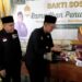 PSHT Cabang Kota Kediri Pusat Madiun Bagikan Ratusan Paket Zakat kepada Warga